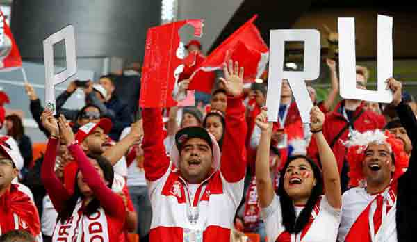 Peru soccer team celebrating as they win first World Cup game in 40 years