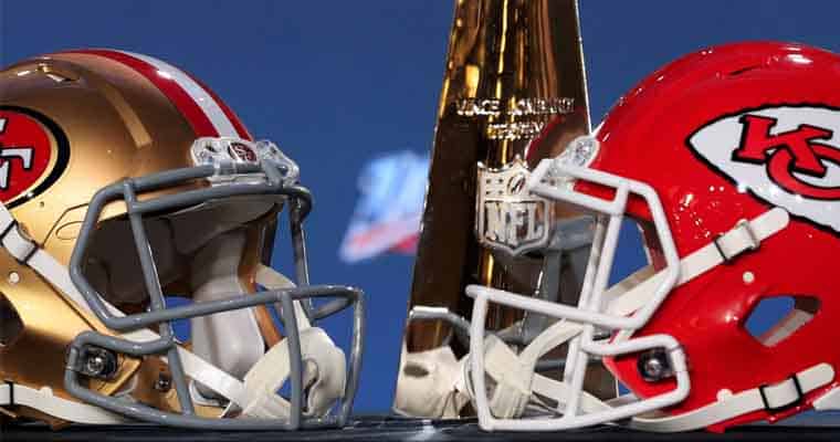 San Francisco and Kansas City helmets next to a Lombardi Trophy