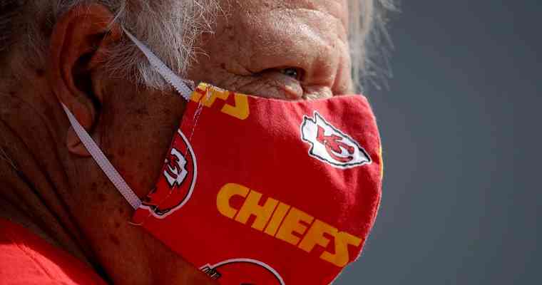 Kansas City Chiefs fan wearing a Chiefs-themed COVID-19 mask