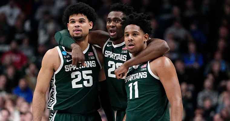 Michigan State Spartans basketball players with their arms around each other