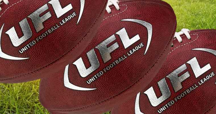 UFL Footballs above grass and sunshine