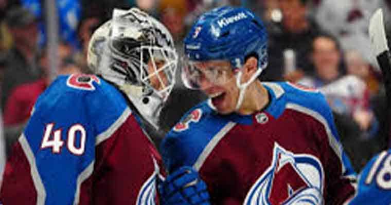 Two Avalanche players celebrating