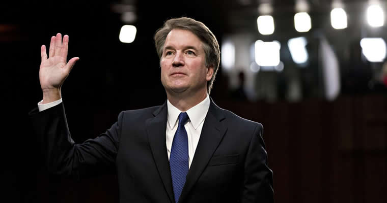 Kavanaugh holding up his right hand