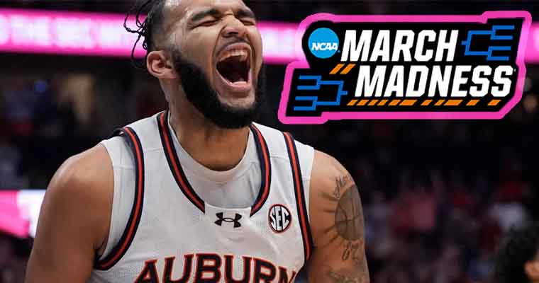 Auburn Tigers basketball player Johni Broome celebrating next to a March Madness logo