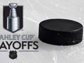 Stanley Cup Playoffs logo next to a hockey puck laying on the ice